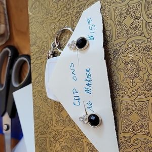 Beautiful pair of clip on earrings. Black and crystal stones